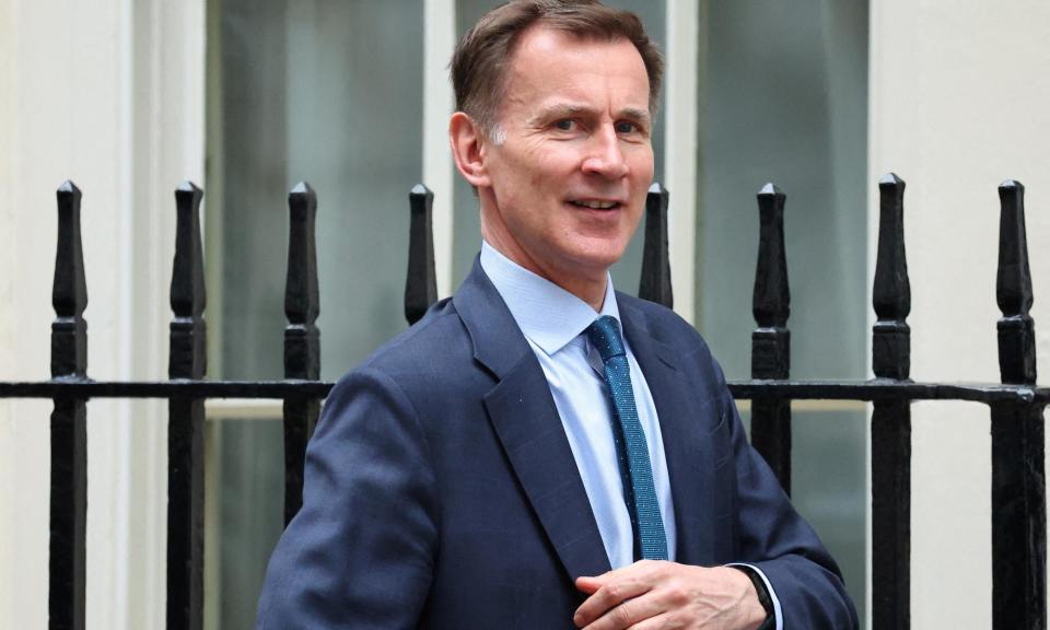 <span>The IMF said it would have advised Jeremy Hunt not to cut national insurance contributions in last year’s autumn statement and the March budget.</span><span>Photograph: Toby Melville/Reuters</span>
