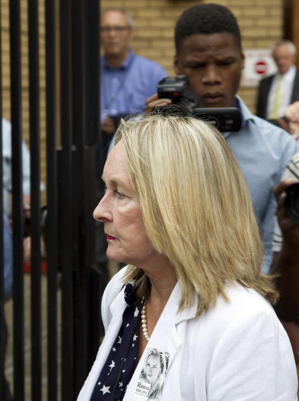 June Steenkamp, mother of Reeva Steenkamp, leaves the high court in Pretoria, South Africa, Monday, March 17, 2014, after a court break for lunch. Oscar Pistorius is charged with murder for the shooting death of his girlfriend, Reeva Steenkamp, on Valentines Day in 2013. (AP Photo/Themba Hadebe)