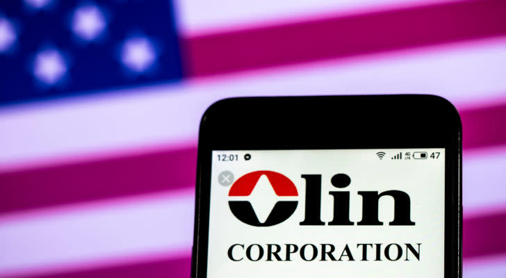 Olin Corp (OLN) logo displayed on a mobile phone screen representing dividend stocks