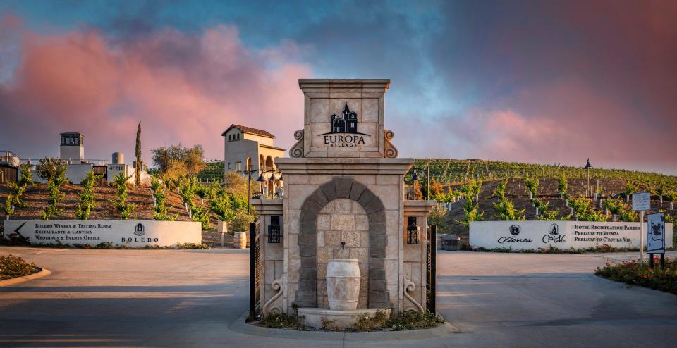 The entrance to Europa Village in Temecula, California, at sunset