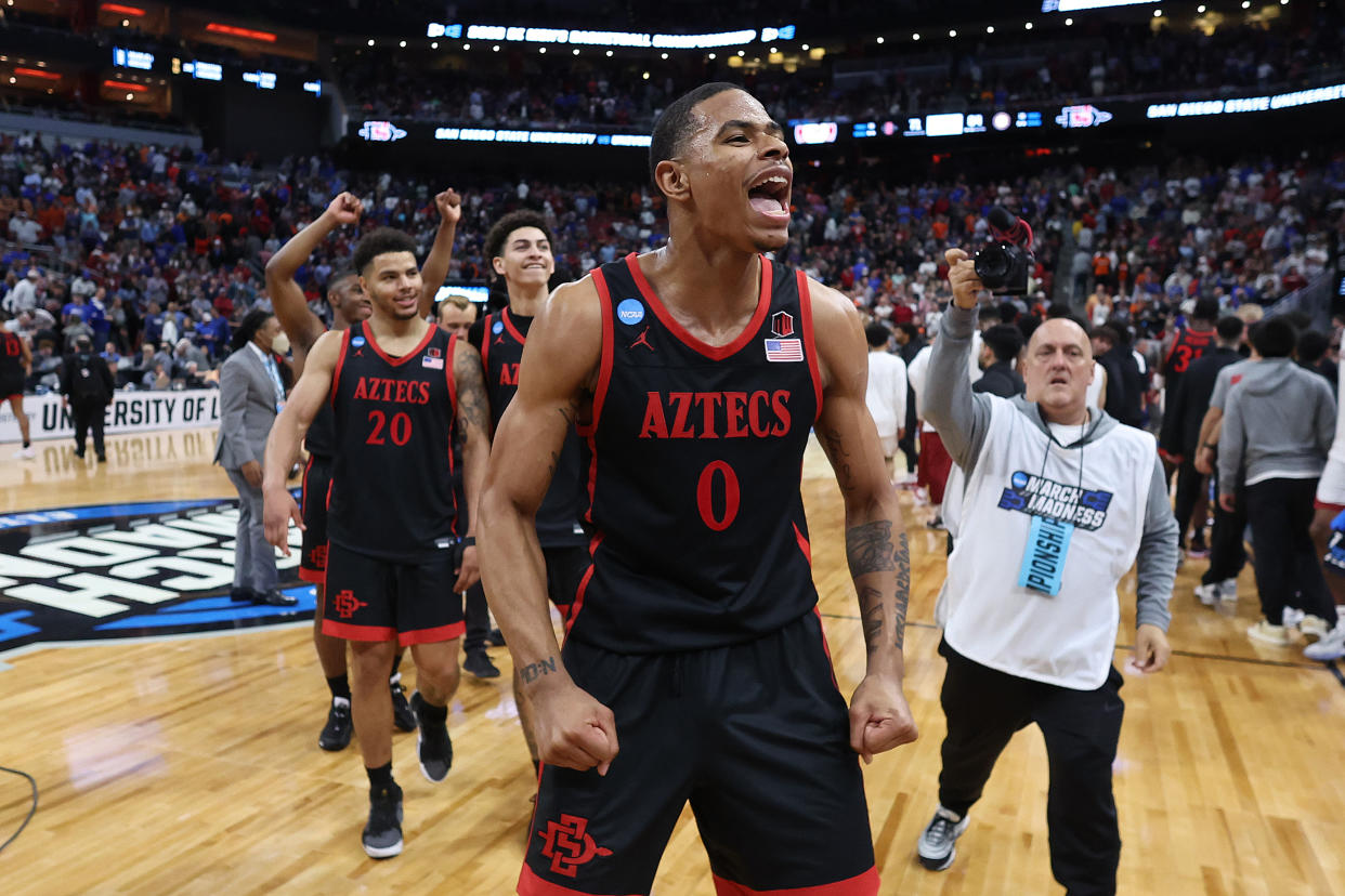 Keshad Johnson (0) and his San Diego State Aztecs teammates celebrate after advancing to the Elite Eight. (Photo by Rob Carr/Getty Images)