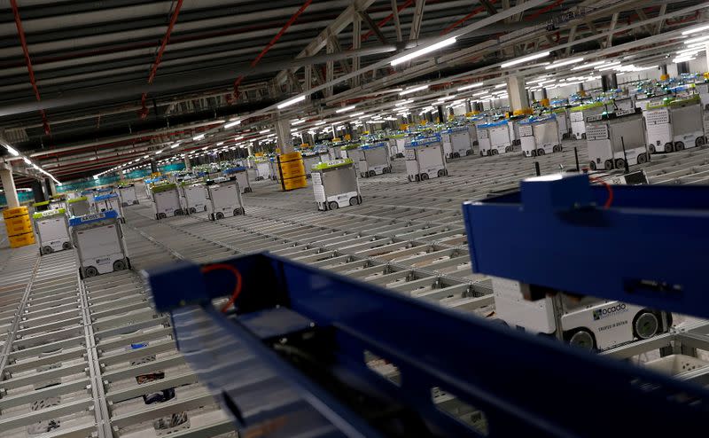 FILE PHOTO: "Bots" are seen on the grid of the "smart platform" at the Ocado CFC (Customer Fulfilment Centre) in Andover