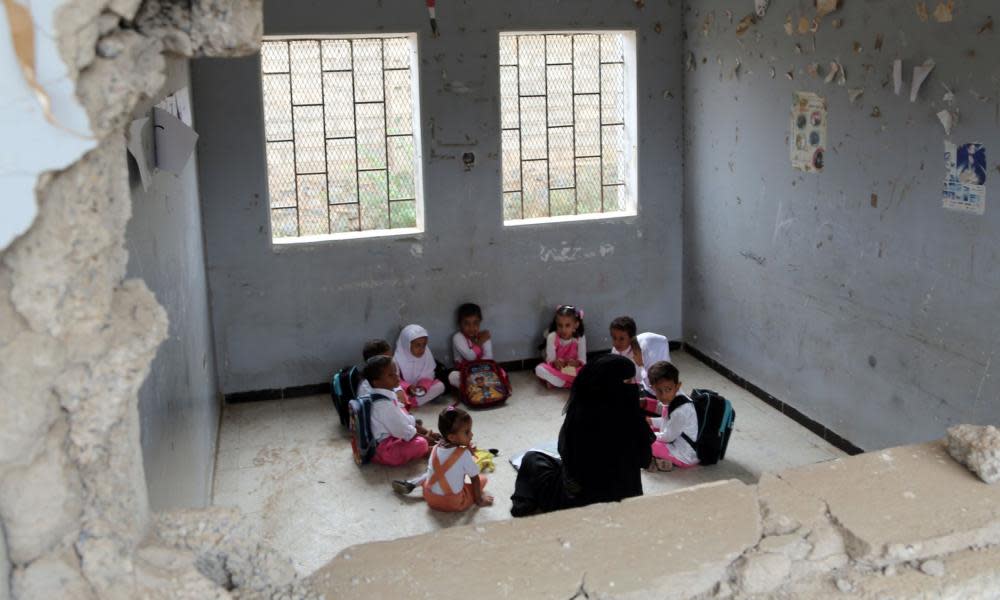 Children attend class at a bomb-damaged school in the port city of Hodeidah