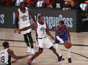 Denver Nuggets guard Monte Morris (11) is defended by Los Angeles Clippers forward Kawhi Leonard (2) in the first half of an NBA basketball game Wednesday, Aug. 12, 2020, in Lake Buena Vista, Fla. (Kim Klement/Pool Photo via AP)