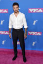 <p>Der frisch getrennte Liam Payne blieb mit einem weißen Hemd und einer schwarzen Hose schlicht. Quelle: Getty </p>