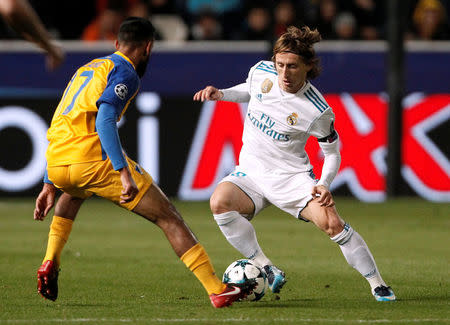 Soccer Football - Champions League - APOEL Nicosia vs Real Madrid - GSP Stadium, Nicosia, Cyprus - November 21, 2017 Real Madrid’s Luka Modric in action with Apoel Nicosia’s Ghayas Zahid REUTERS/Yiannis Kourtoglou