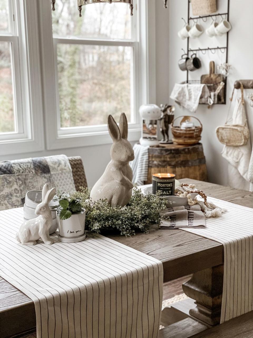 <p>This has to be the perfect centerpiece for any Easter table. “I love to mix old and new and add hand-picked treasures from many small shops to create a unique blend of farmhouse and classic home aesthetic,” say <a href="https://www.instagram.com/velveteenandgrace/" rel="nofollow noopener" target="_blank" data-ylk="slk:Tina and Taylor Oddo" class="link ">Tina and Taylor Oddo</a>—proof that we needn’t be afraid to dive into the closet or storage room. You never know what might be repurposed as a splendid statement piece. <br></p>