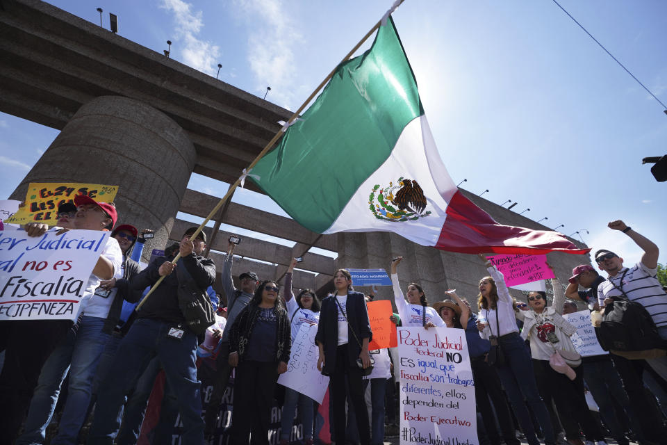 Judicial workers protest funding cuts to next year's judiciary budget as they start a national, two-week strike, outside their offices in Mexico City, Thursday, Oct. 19, 2023. (AP Photo/Marco Ugarte)