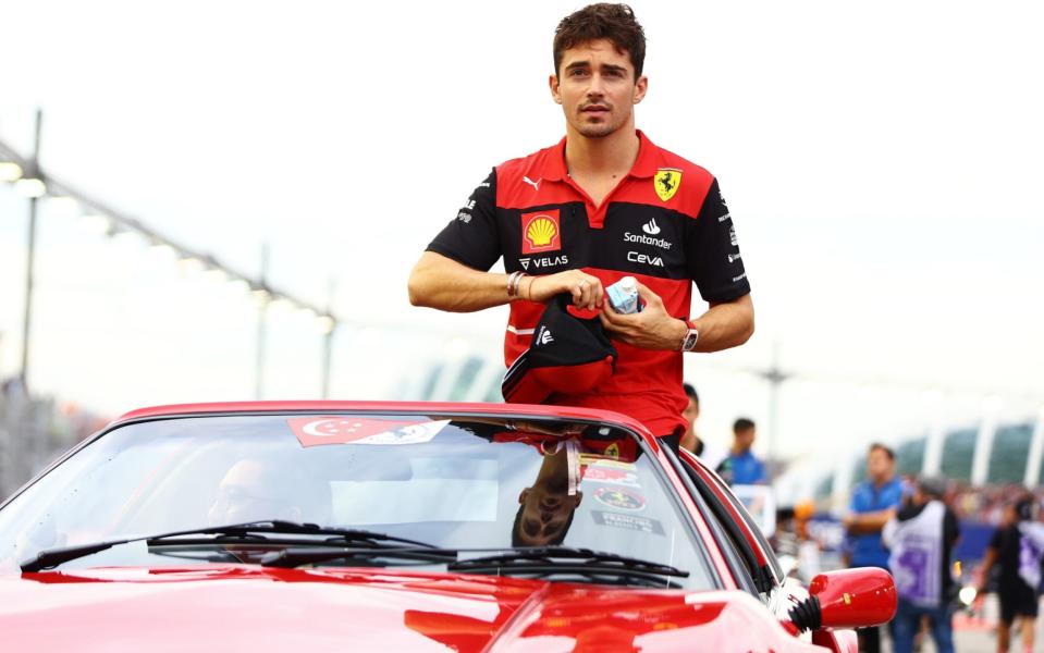 Charles Leclerc of Monaco and Ferrari looks on from the drivers parade prior to the F1 Grand Prix of Singapore at Marina Bay Street Circuit on October 02, 2022 in Singapore, Singapore. -  Mark Thompson/Getty Images