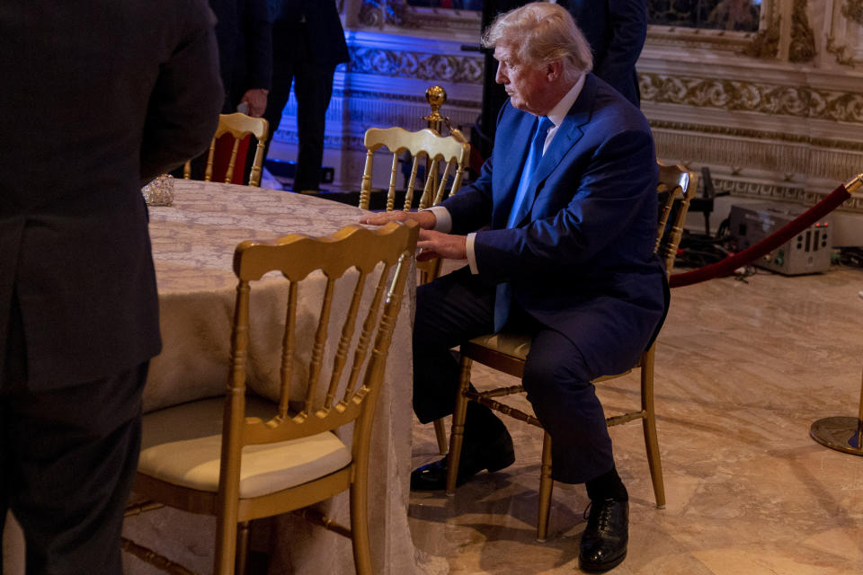 Former President Donald Trump takes a seat at Mar-a-lago on Election Day, Tuesday, Nov. 8, 2022, in Palm Beach, Fla. (AP Photo/Andrew Harnik)