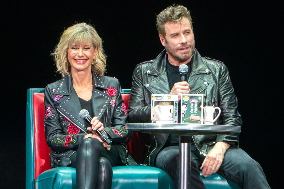 John Travolta and Olivia Newton-John are reunited in West Palm Beach, Florida, where they dressed up as their <em>Grease</em> characters Danny Zuko and Sandy Olsson for a movie sing-along event on Friday.