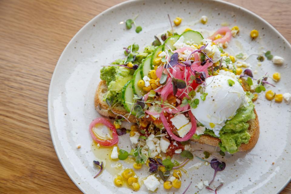 The avocado toast from St. Kilda features charred corn, feta and pickled red onion for tang, cucumber for freshness, and a tomato salsa tied it together with subtle heat.