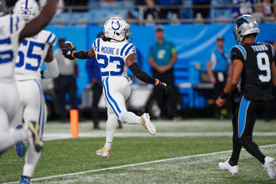 Indianapolis Colts cornerback Kenny Moore II celebrates after scoring on an interception against the Carolina Panthers during the first half of an NFL football game Sunday, Nov. 5, 2023, in Charlotte, N.C. (AP Photo/Jacob Kupferman)