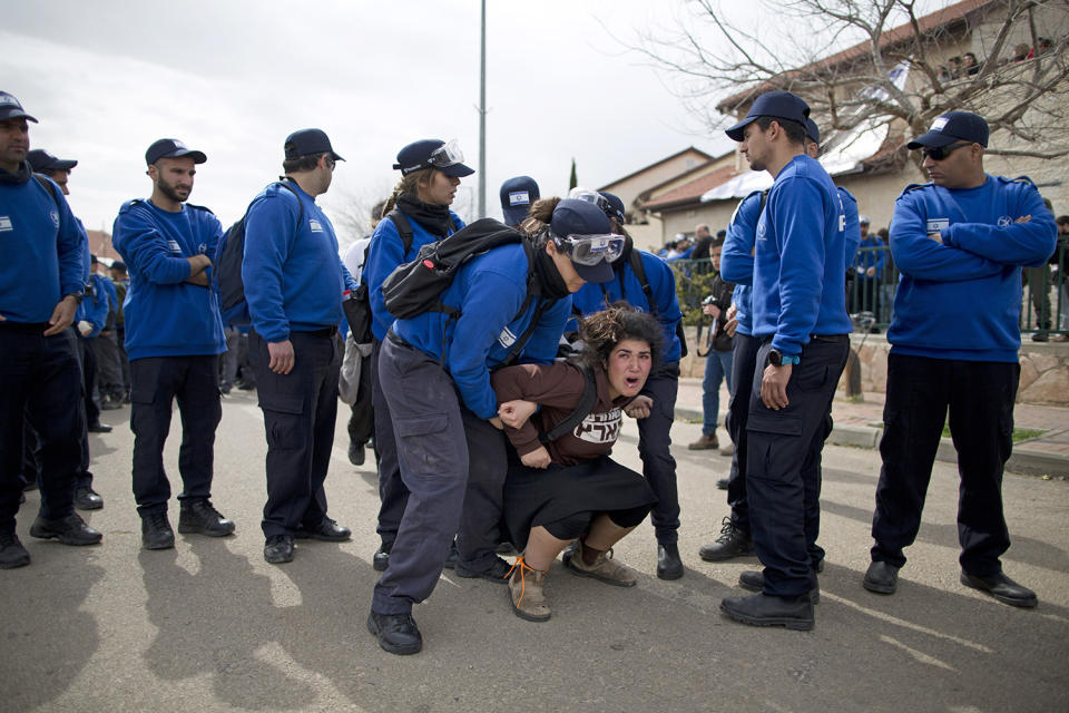 <p>Israeli police evicts a settler from the West Bank settlement of Ofra, Tuesday, Feb. 28, 2017. Israeli forces began evacuating nine homes in the settlement following a Supreme Court decision that ruled they were built on private Palestinian land. (AP Photo/Oded Balilty) </p>