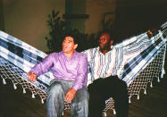 FILE - Argentine soccer star Diego Armando Maradona, left, rests in a hammock with Brazilian soccer star Pele, during a meeting in Rio de Janeiro, Brazil, May 13, 1995. Pelé, the Brazilian king of soccer who won a record three World Cups and became one of the most commanding sports figures of the last century, died in Sao Paulo on Thursday, Dec. 29, 2022. He was 82. (AP Photo/G. Copolla, File)