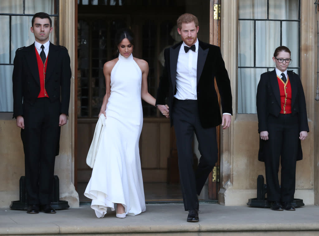 Meghan Markle looked reception-ready in Stella McCartney’s beautiful mock-neck design. (Photo: Getty Images)