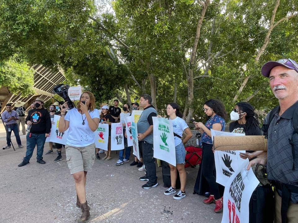 Tempe residents and activists call for a change to the proposed Tempe police budget outside Tempe City Hall on June 9, 2022.