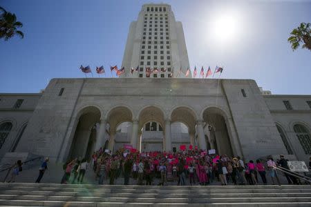 Activists rally in support of Planned Parenthood on "National Pink Out Day" on the steps of City Hall in Los Angeles, California September 29, 2015. REUTERS/Mario Anzuoni