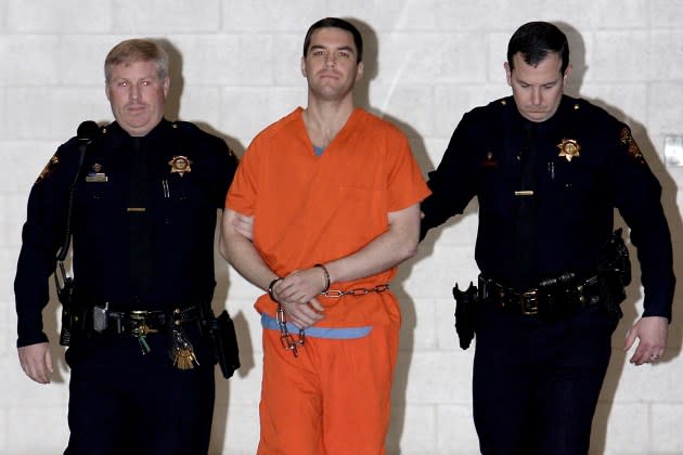 Convicted murderer Scott Peterson is escorted by two sheriff deputies on March 17, 2005 in Redwood City, California.  - Credit: Justin Sullivan/Getty Images