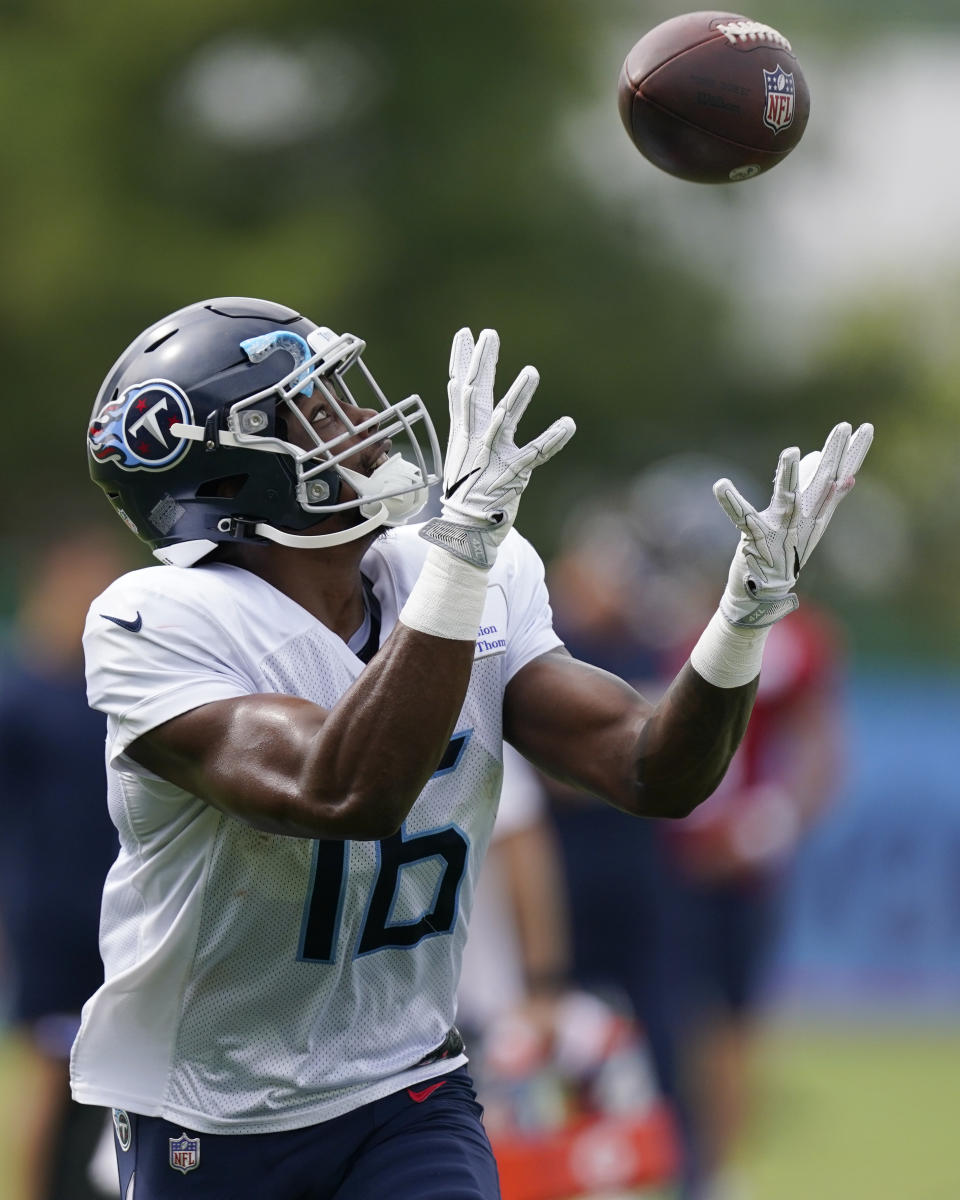 Tennessee Titans wide receiver Treylon Burks reaches for a pass during training camp at the NFL football team's practice facility Monday, Aug. 1, 2022, in Nashville, Tenn. (AP Photo/Mark Humphrey)