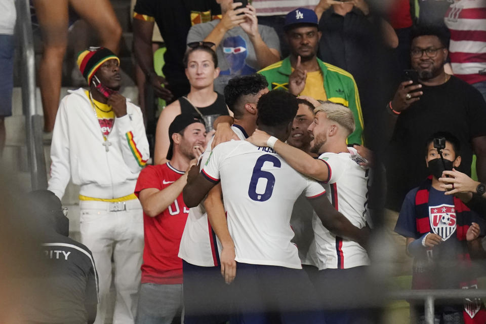 United States' Yunus Musah (6) celebrates with teammates after the team scored against Jamaica during a FIFA World Cup qualifying soccer match Thursday, Oct. 7, 2021, in Austin, Texas. (AP Photo/Eric Gay)