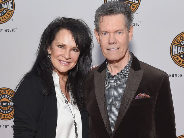 <p>Jason Kempin/Getty</p> Mary Davis and Randy Travis attend the 2018 Country Music Hall of Fame and Museum Medallion Ceremony on October 21, 2018 in Nashville, Tennessee.