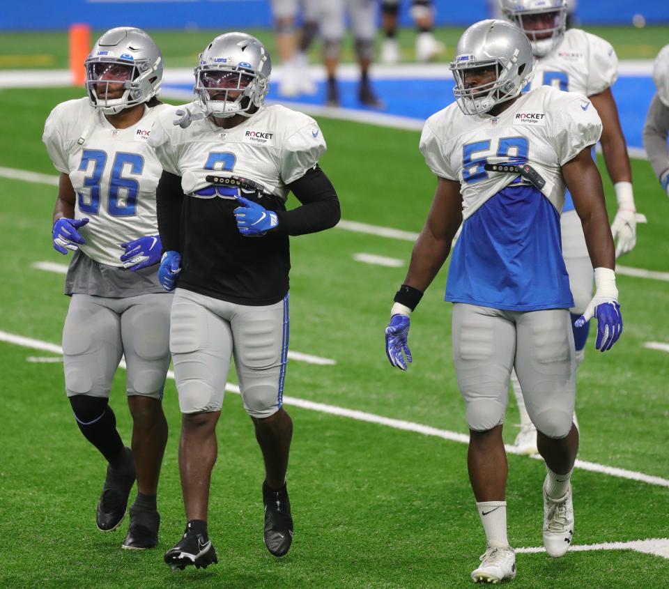 Left to right: Detroit Lions running backs Jonathan Williams, D'Andre Swift and Jason Cabinda on the field during practice at Ford Field, Tuesday, September 2, 2020.