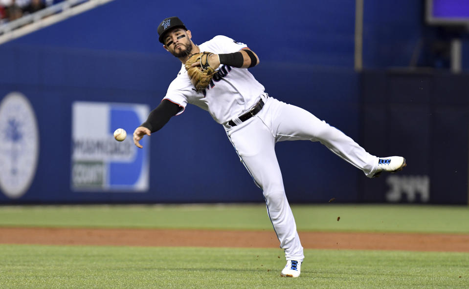Miami Marlins' third baseman Eddy Alvarez throws out a runner at first base during the second inning of a baseball game against the Pittsburgh Pirates, Sunday, Sept. 19, 2021, in Miami. (AP Photo/Jim Rassol)