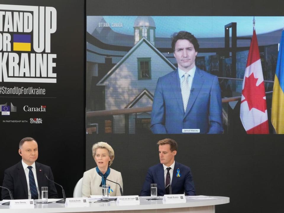 Prime Minister Justin Trudeau joins a global pledge rally remotely from Ottawa, co-hosting the event with European Commission head Ursula von der Leyen, seated centre, on Saturday. (Czarek Sokolowski/AP - image credit)