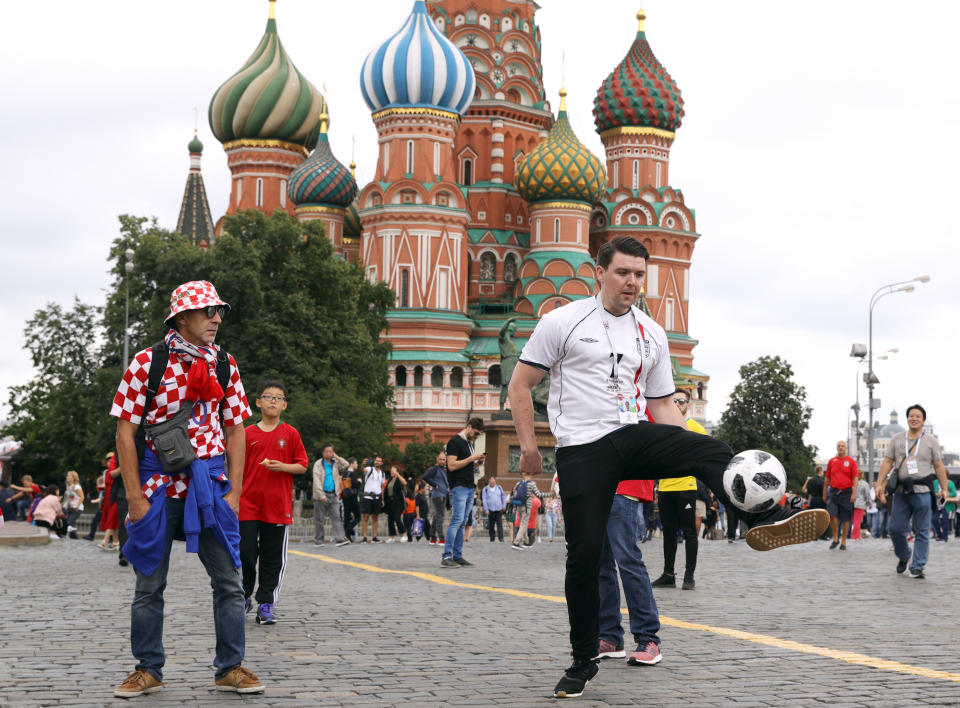 Fans mix in central Moscow hours before the match. (PA)