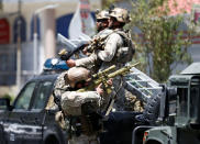 <p>A member of the Afghan security forces aims his rifle during gun fire at the site of an attack in Kabul, Afghanistan July 31, 2017. (Mohammad Ismail/Reuters) </p>