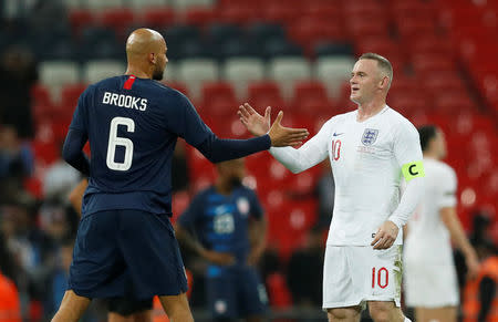 Soccer Football - International Friendly - England v United States - Wembley Stadium, London, Britain - November 15, 2018 England's Wayne Rooney shakes hands with John Brooks of the U.S. at the end of the match Action Images via Reuters/John Sibley