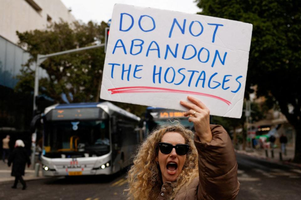 A woman takes part in a protest demanding a hostage deal in Tel Aviv earlier this month (Reuters)