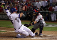 ARLINGTON, TX - OCTOBER 22: Mike Napoli #25 of the Texas Rangers is tagged out at home plate by Yadier Molina #4 of the St. Louis Cardinals in the fourth inning during Game Three of the MLB World Series at Rangers Ballpark in Arlington on October 22, 2011 in Arlington, Texas. (Photo by Doug Pensinger/Getty Images)