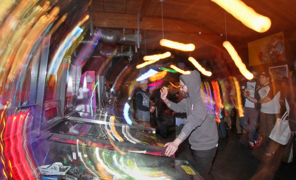 Eric Csakany practices his game during a break in the competition at Another Castle Arcade in Bremerton. You will find all the bells and whistles as well as lights and action during local pinball competitions.
