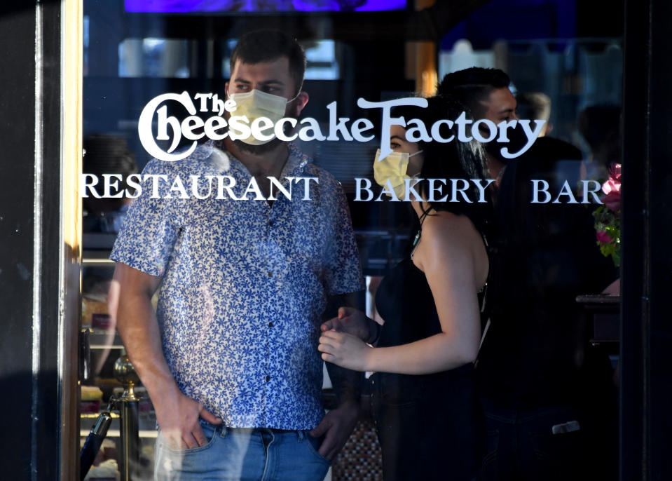 PASADENA, CA - JUNE 12:  Patrons of Cheesecake Factory looks on as demonstrators protest along Colorado Blvd. during a Black Lives Matter protest after the death of George Floyd, a black man who was in police custody in Minneapolis in Pasadena on Friday, June 12, 2020. (Photo by Keith Birmingham/MediaNews Group/Pasadena Star-News via Getty Images)