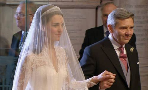 While Kate's veil was attached to a Cartier tiara, lent to her by the Queen as her "something borrowed."