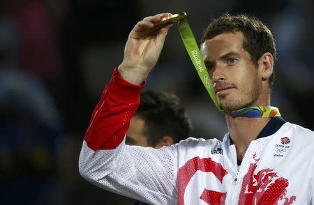 2016 Rio Olympics - Tennis - Victory Ceremony - Men's Singles Victory Ceremony - Olympic Tennis Centre - Rio de Janeiro, Brazil - 14/08/2016. Gold medalist Andy Murray (GBR) of Britain reacts after receiving his medal. REUTERS/Marcos Brindicci