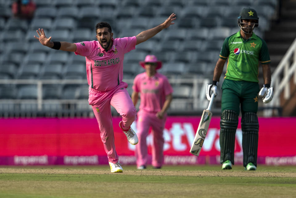 FILE - In this April 4, 2021, file photo, South Africa's bowler Tabraiz Shamsi, left, celebrates after dismissing Pakistan's batsman Shadab Khan on LBW as teammate Fakhar Zaman watches on during the second One Day International cricket match between South Africa and Pakistan at the Wanderers stadium in Johannesburg, South Africa. Shamsi is the top-ranked spin bowler in T20 internationals, which may come as a surprise to some considering the Proteas' long-established reliance on fast bowling to get the job done. (AP Photo/Themba Hadebe, File)