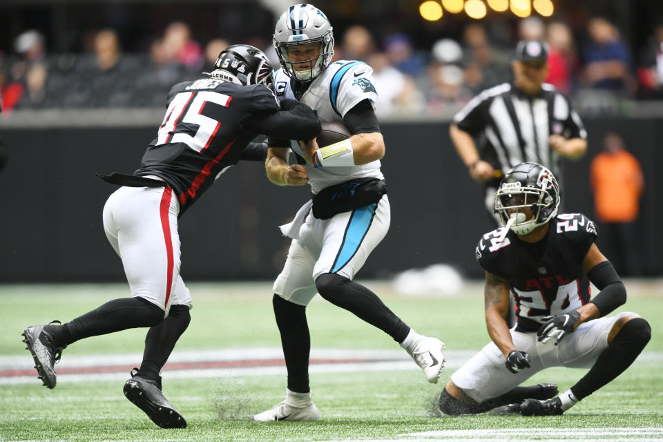 Atlanta Falcons linebacker Deion Jones (45) hits Carolina Panthers quarterback Sam Darnold (14) during the first half of an NFL football game, Sunday, Oct. 31, 2021, in Atlanta. (AP Photo/John Amis)