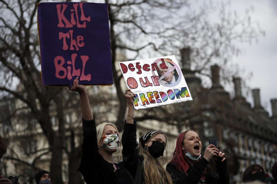 Demonstrators hold posters during a 'Kill the Bill' protest in London, Saturday, April 3, 2021. The demonstration is against the contentious Police, Crime, Sentencing and Courts Bill, which is currently going through Parliament and would give police stronger powers to restrict protests. (AP Photo/Matt Dunham)