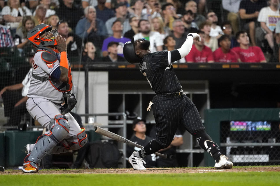 Chicago White Sox's Josh Harrison, right, and Houston Astros catcher Martin Maldonado watch Harrison's inning-ending popup during the seventh inning of a baseball game Monday, Aug. 15, 2022, in Chicago. (AP Photo/Charles Rex Arbogast)