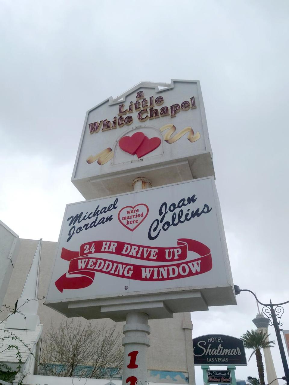 A sign for the Little White Wedding Chapel advertises celebrities who have been married inside