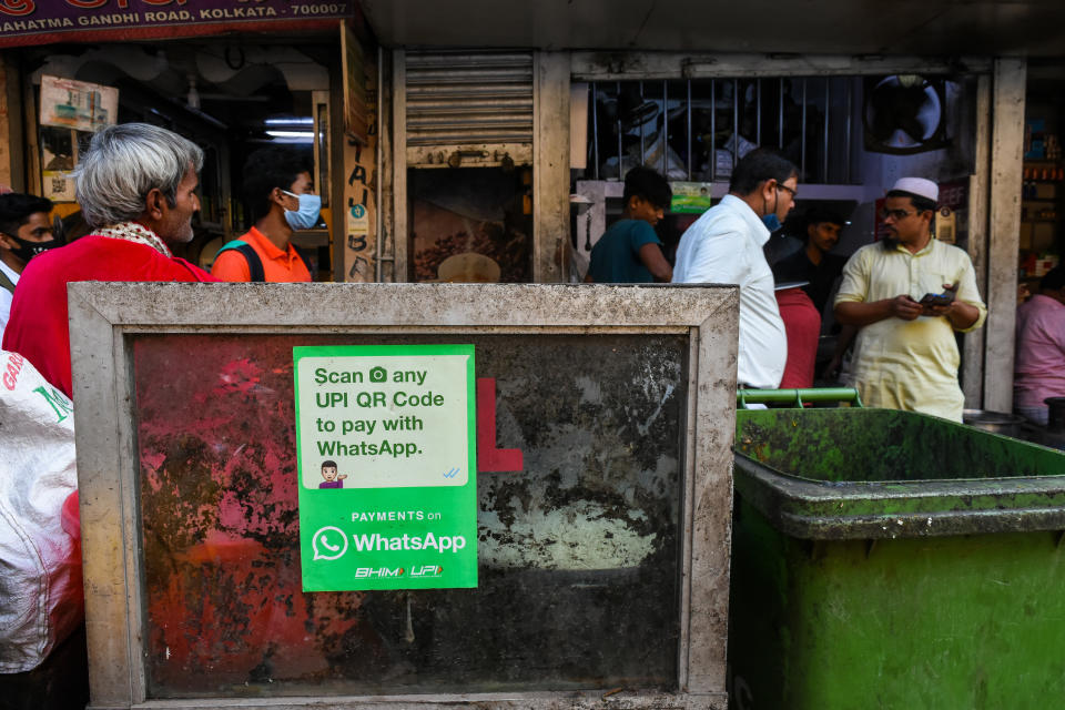 A WhatsApp pay payment sticker as seen outside a food shop in Kolkata , India , on 30 November 2021 . WhatsApp India plans to make  significant investments in next 6 months regarding its payments platform across India , to accelerate its growth in the market where digital payments has seen a significant rise in recent tomes . (Photo by Debarchan Chatterjee/NurPhoto via Getty Images)