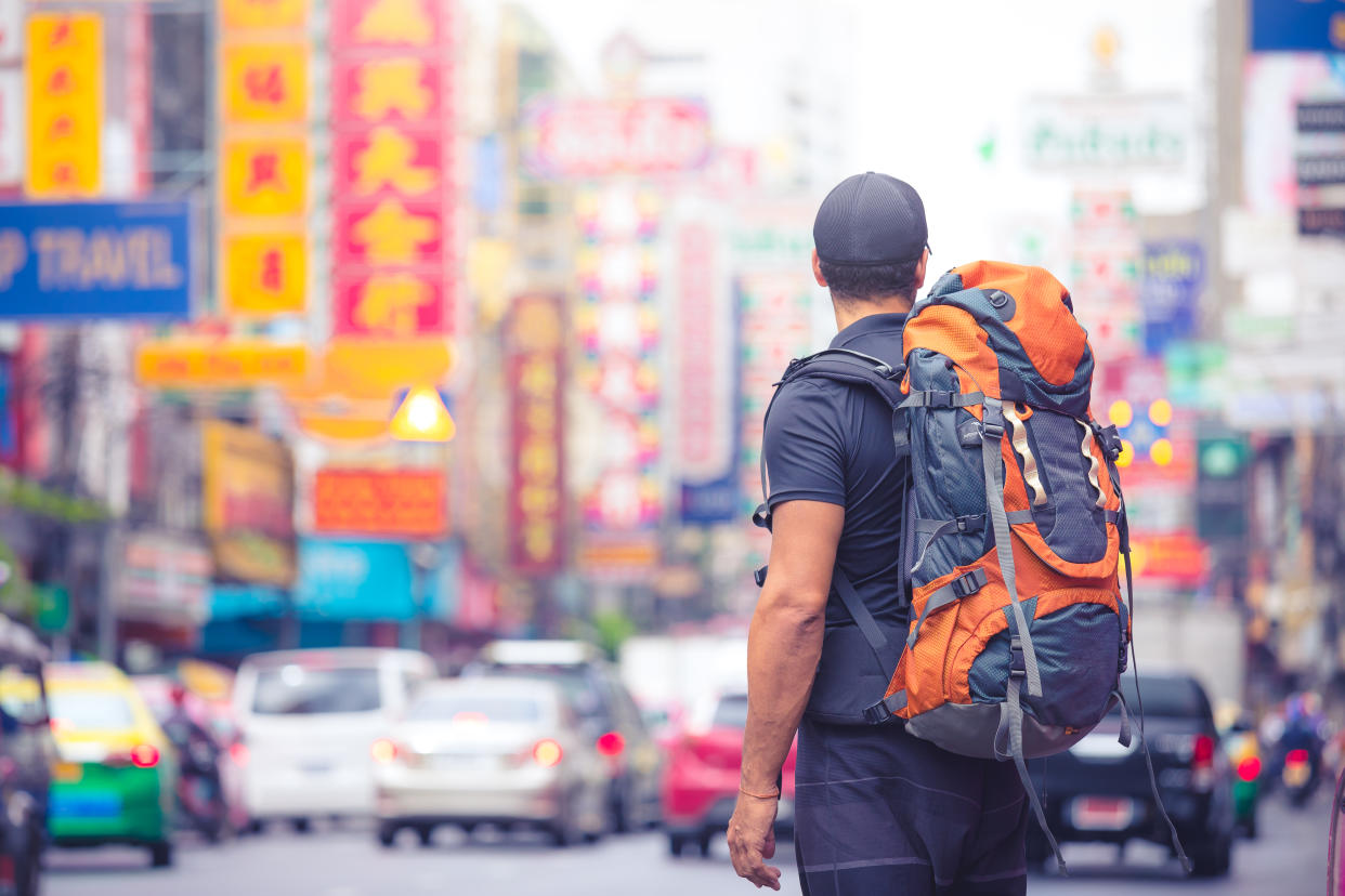 A tourist visits a major city in China. (Photo from Getty Images)