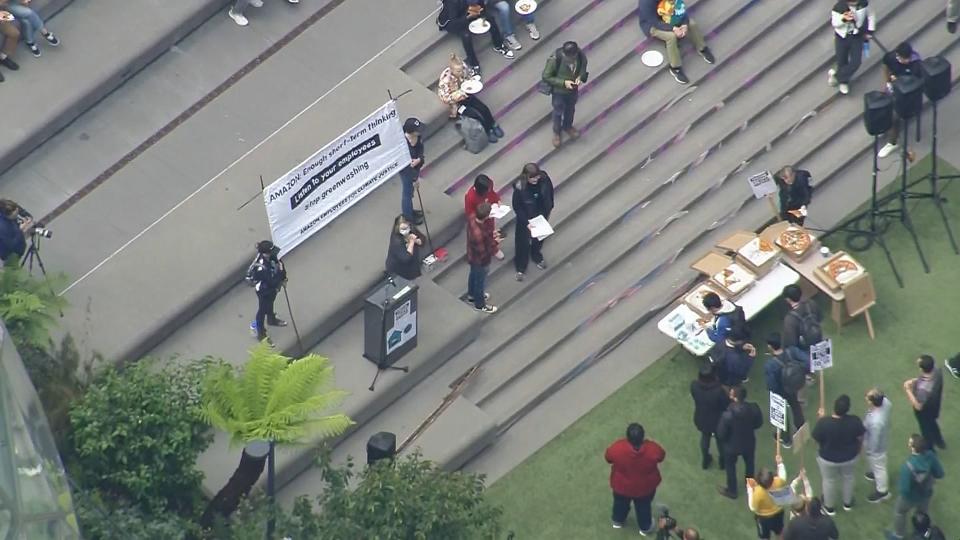 Hundreds of Amazon workers in Seattle walked out over a return-to-office mandate, layoffs, climate commitments and other issues.