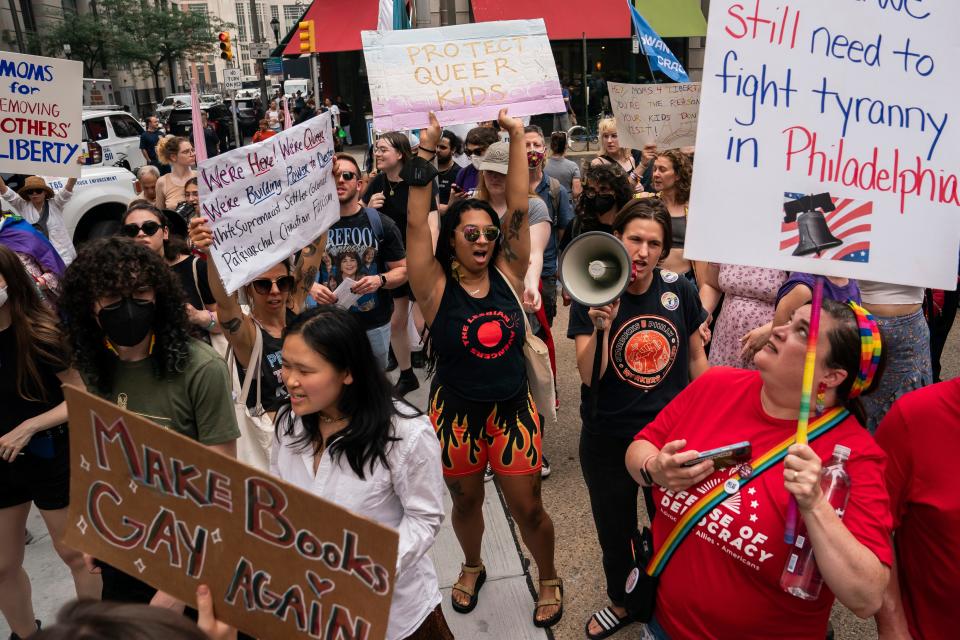 Demonstrators gather outside the Moms for Liberty meeting in Philadelphia, Friday, June 30, 2023. (AP Photo/Nathan Howard)