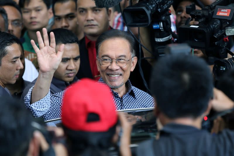 Malaysia's politician Anwar Ibrahim leaves after a meeting in Petaling Jaya