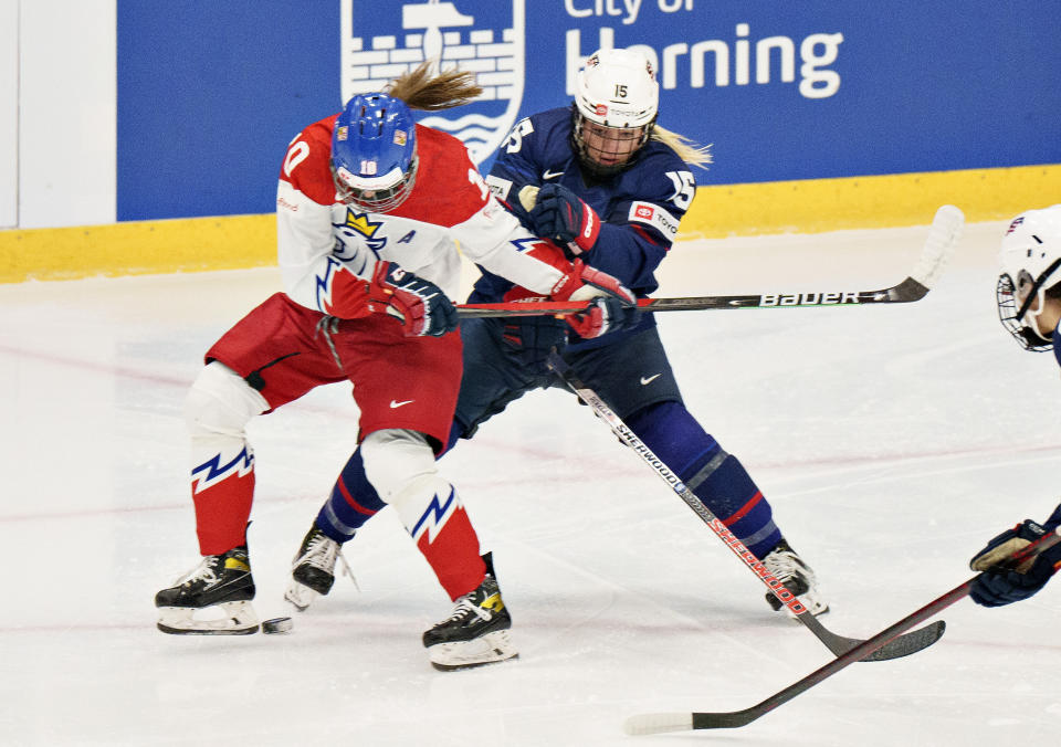 Denisa Krizova of Czech Republic in action against Savannah Harmon of USA during The IIHF World Championship Woman's ice hockey semi-finals match between USA and Czech Republic in Herning, Denmark, Saturday, Sept. 3, 2022. (Henning Bagger/Ritzau Scanpix via AP)