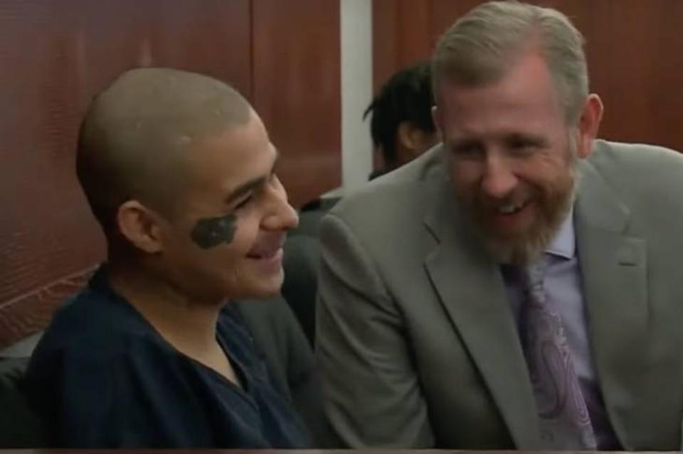 The pair were seen laughing and smiling towards the family of the former police chief (KTNV)